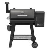 Nexgrill Oakford 715 pellet grill on white, front view, chimney, front table down, grease bucket hanging