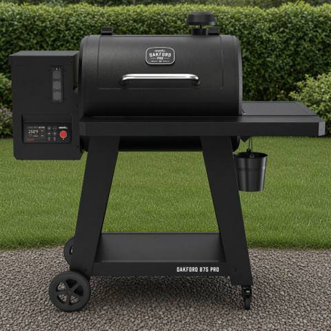 Black Nexgrill Oakford 875 Pro pellet grill on flagstones by a raised vegetable bed, controller lit, evening light