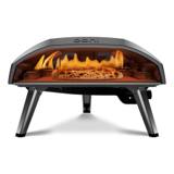 Ooni Koda 16 gas pizza oven from the front, flame lit along the back and left wall, a pizza on the stone