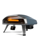 Ooni Koda 2 Pro from the front, flames along both side walls, digital temperature hub on a bracket below the mouth