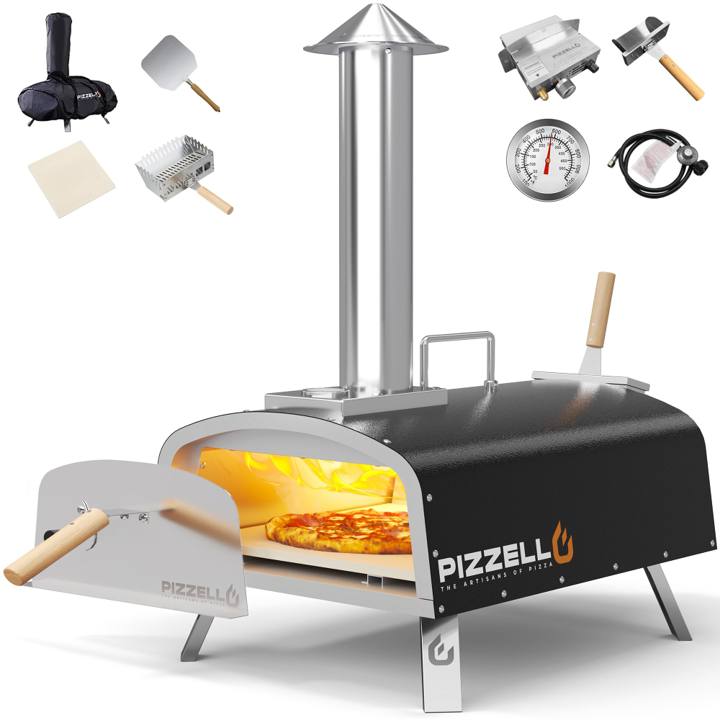 Black Pizzello 16 inch oven with its door off, tall chimney, and the peel, stone, burners and bag laid around it