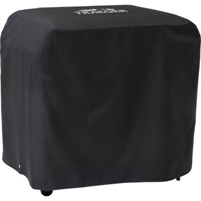 Black Traeger BAC889 cover drawn over a Flatrock 3 Zone griddle, white Traeger logo on the lid, casters showing below