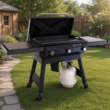 Traeger Flatrock griddle on grass with the lid raised, flat steel cooktop and both fold-out side shelves open