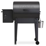 Black Traeger Tailgater pellet grill, front view on white, hopper and controller at left, grease bucket at right