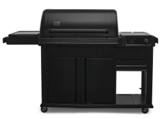 Traeger Woodridge Elite on white: black barrel, full storage cabinet, side burner on the left and digital controller right