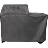 Gray Traeger full-length cover on a Woodridge pellet grill, mountain logo on the hood, wheels showing under the hem