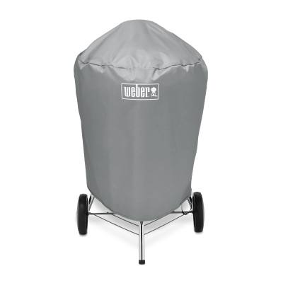 Gray Weber 7176 cover fitted over a 22 inch kettle, legs and wheels showing below the hem