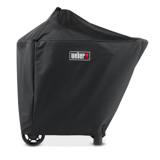 Black Weber Performer cover fitted over a kettle and cart, red Weber badge, wheels and legs showing below the hem