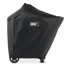 Black Weber Performer cover fitted over a kettle and cart, red Weber badge, wheels and legs showing below the hem