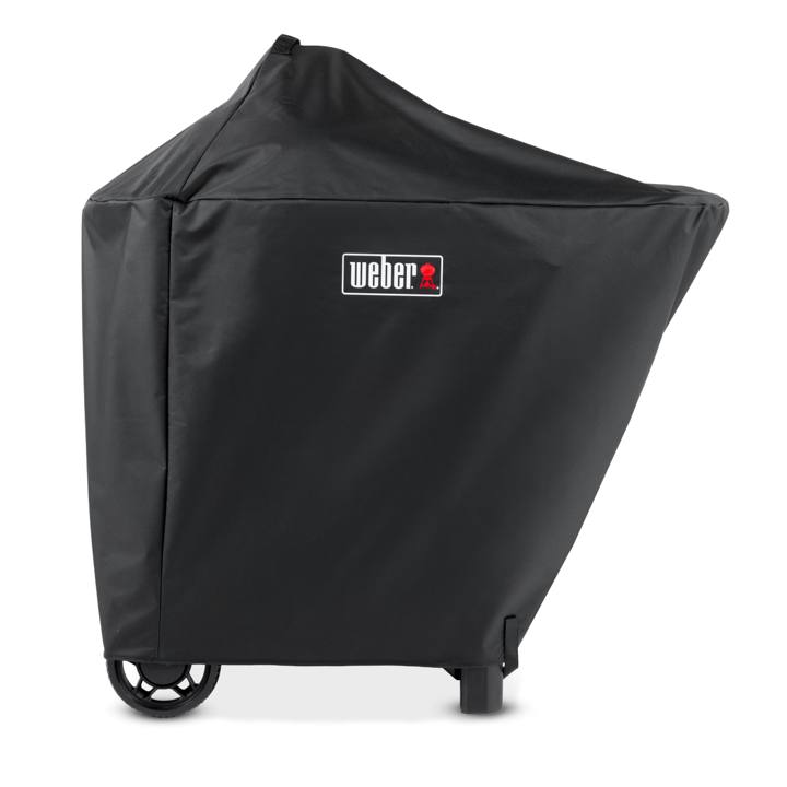 Black Weber Performer cover fitted over a kettle and cart, red Weber badge, wheels and legs showing below the hem