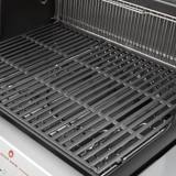 Genesis E-435 porcelain-enameled cast iron cooking grates with the stainless warming rack above them