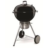Black Weber Master-Touch 22 inch kettle on three legs with two wheels, a wire shelf and an enclosed ash catcher