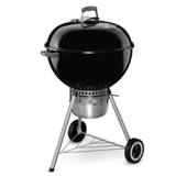 Black Weber Original Kettle Premium 22 with lid closed, lid thermometer, enclosed ash catcher, wire shelf and two wheels