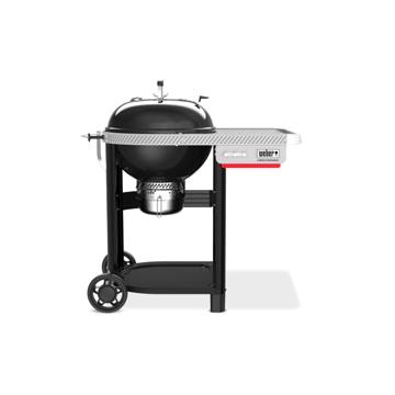 Black Weber Performer kettle set in its cart, with a grey side table, a lower shelf and two wheels