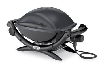 Weber Q 1400 electric grill in dark grey with its lid closed, nylon frame legs and black power cord coiled beside it