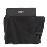 Black Weber cover drawn over a Searwood pellet grill, shaped lower over the hopper, with a strap at the side