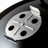Close-up of the stainless steel vent damper on the black lid of the Weber Smokey Mountain