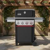 Weber Spirit E-425 on a stone terrace under a pergola, lid closed, four knobs with two red Sear Zone knobs