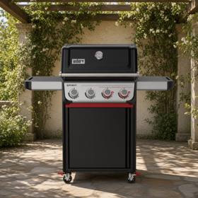 Weber Spirit E-425C on flagstone under a pergola, lid closed, four swivel casters with red lock levers