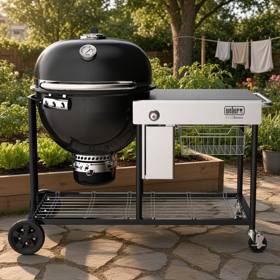 Weber Summit Kamado S6: black kamado bowl at one end of a black cart, stainless worktop filling the rest