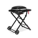 Three-quarter view of the Weber Traveler Compact standing open on its folding frame, side table extended